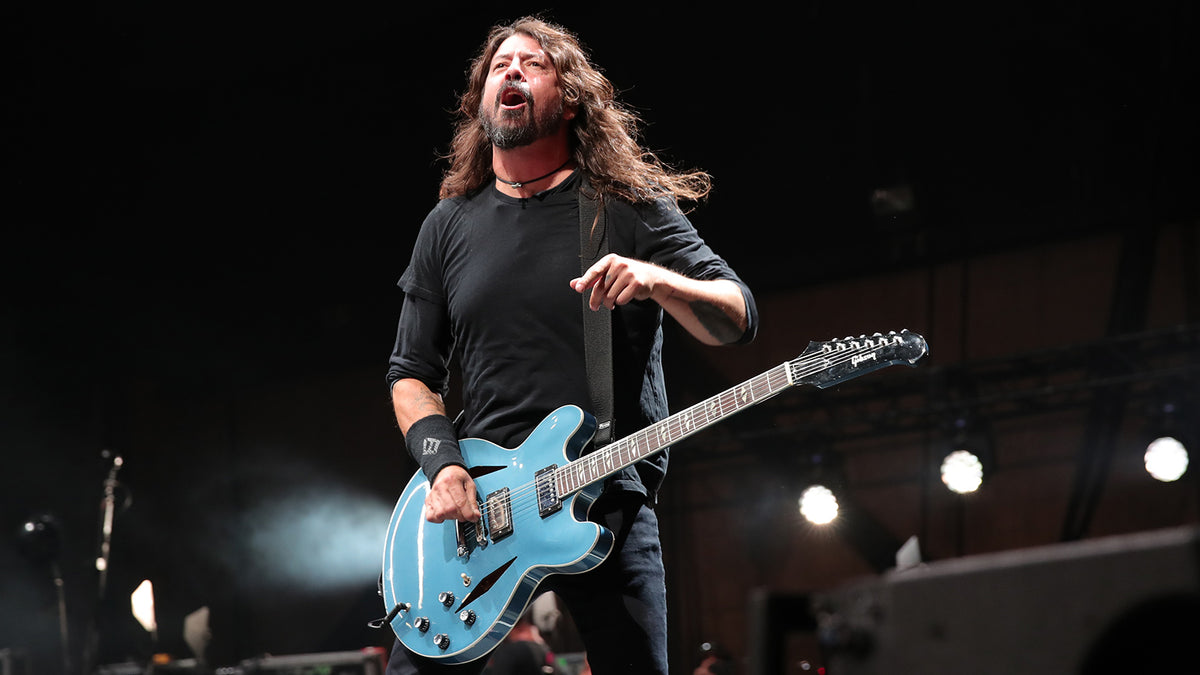 Watch Foo Fighters’ Dave Grohl Fall Off Stage After Chugging a Beer
