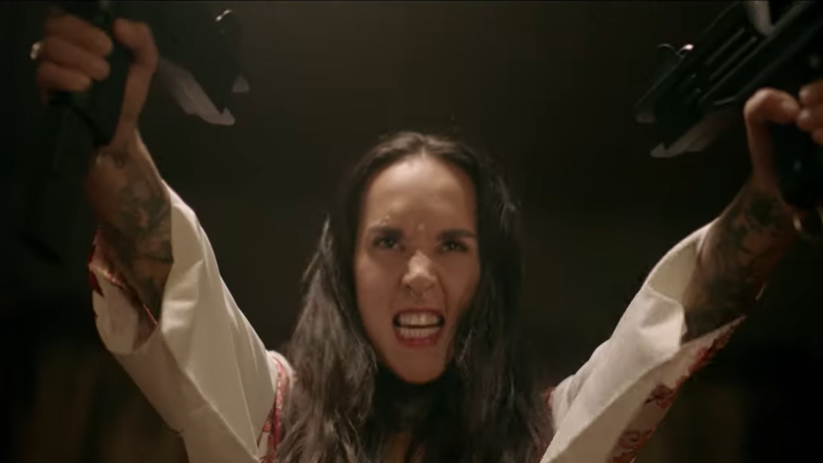 Jinjer: See Tatiana Shmayluk Wield Guns in Wild Video for New Song “Wallflower”