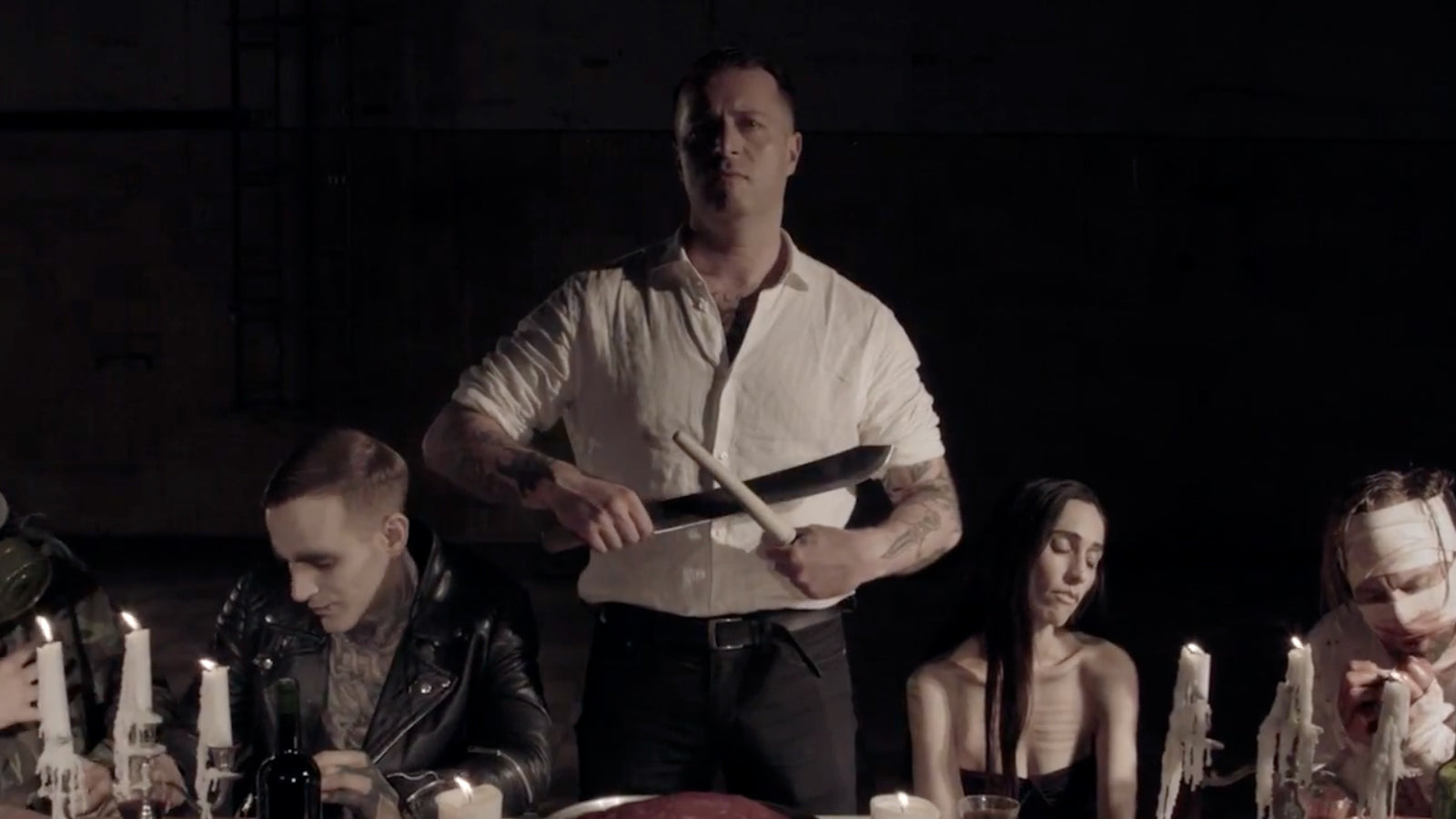 See Gloom Rocker King Dude Create “Demented Last Supper” in Haunting New Video