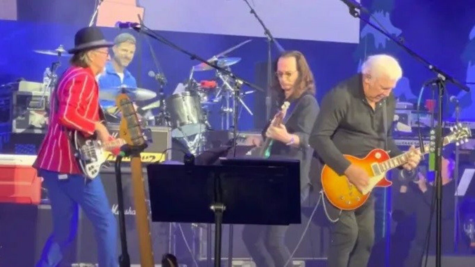 See Rush’s Geddy Lee and Alex Lifeson Reunite to Play “Closer to the Heart” With Primus