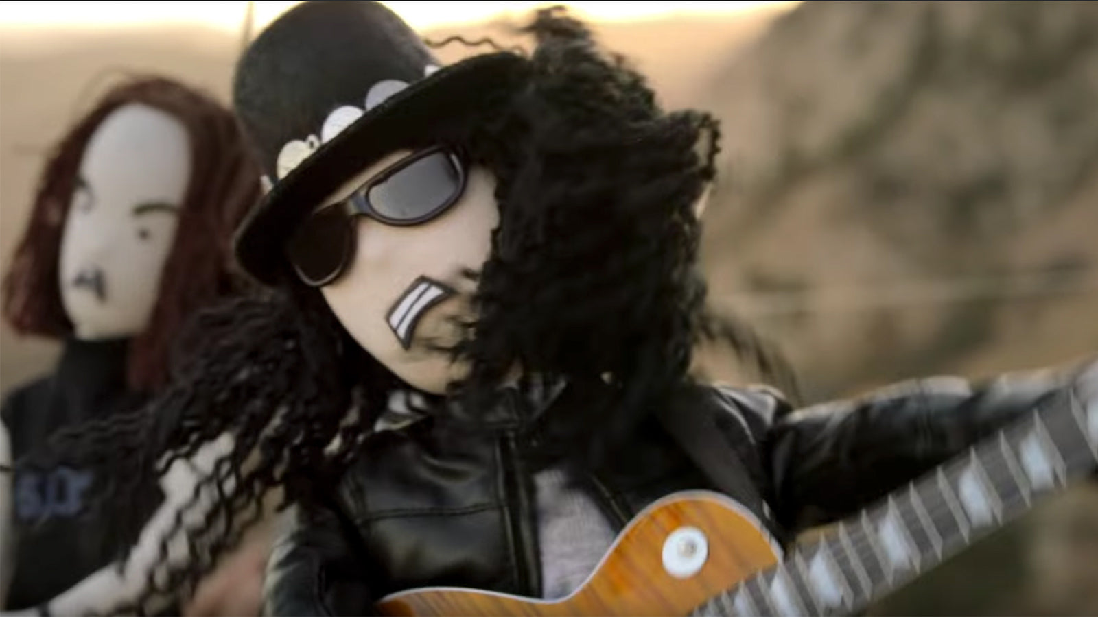 See Slash, Myles Kennedy as Puppets in Adorable, Insane New “Driving Rain” Video