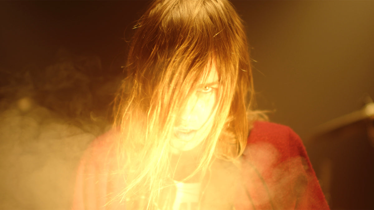 See Johanna Warren as Grunge Icon and Teen Cheerleader in New “Twisted” Video