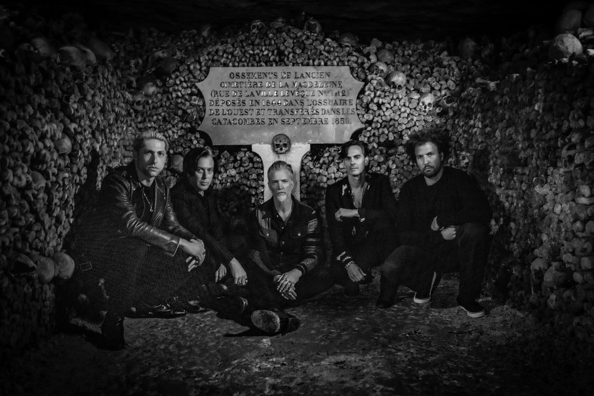 See QUEENS OF THE STONE AGE play in bone-lined Catacombs of Paris