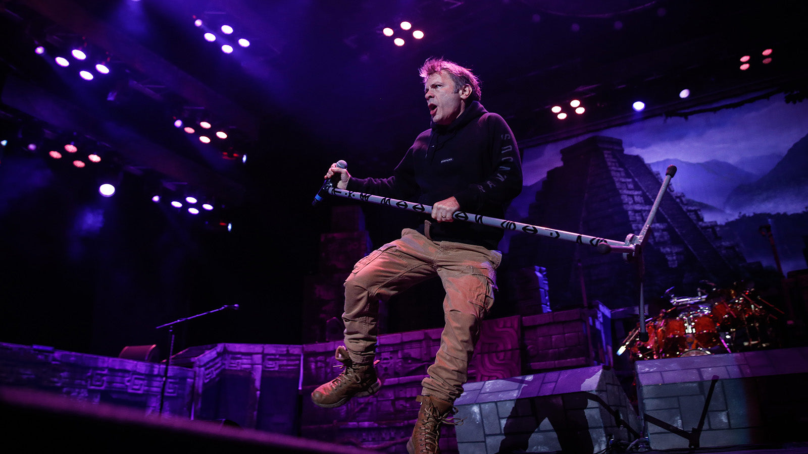 See Iron Maiden’s Bruce Dickinson Fall Off Stage, Recover Without Missing a Beat