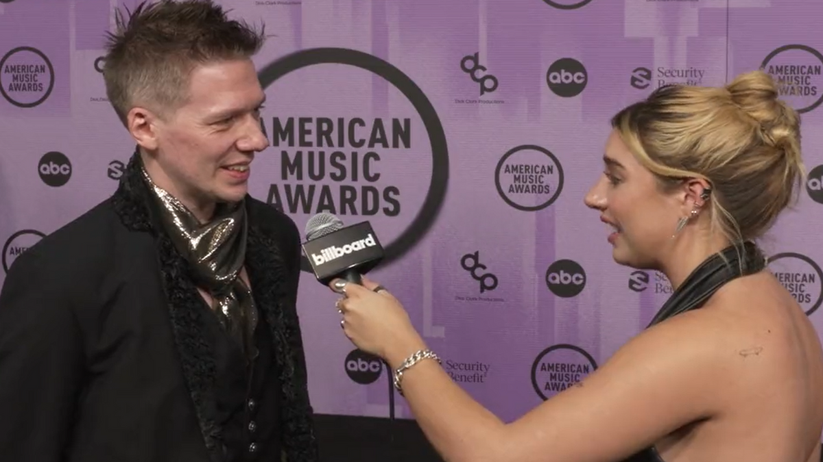 See Ghost’s Endearingly Awkward Red Carpet Interview at American Music Awards