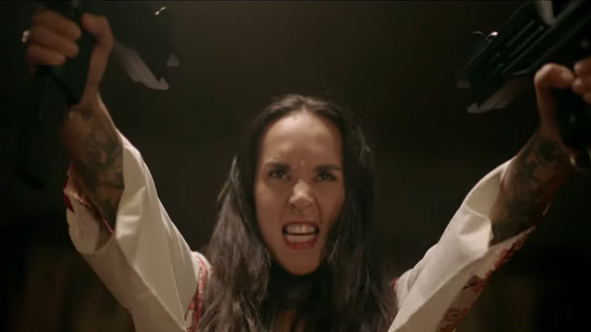 Jinjer: See Tatiana Shmayluk Wield Guns in Wild Video for New Song “Wallflower”