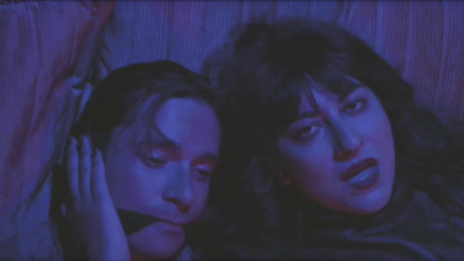 See King Woman Singer Exact Neon-Noir Revenge in Miserable’s New “Loverboy” Video