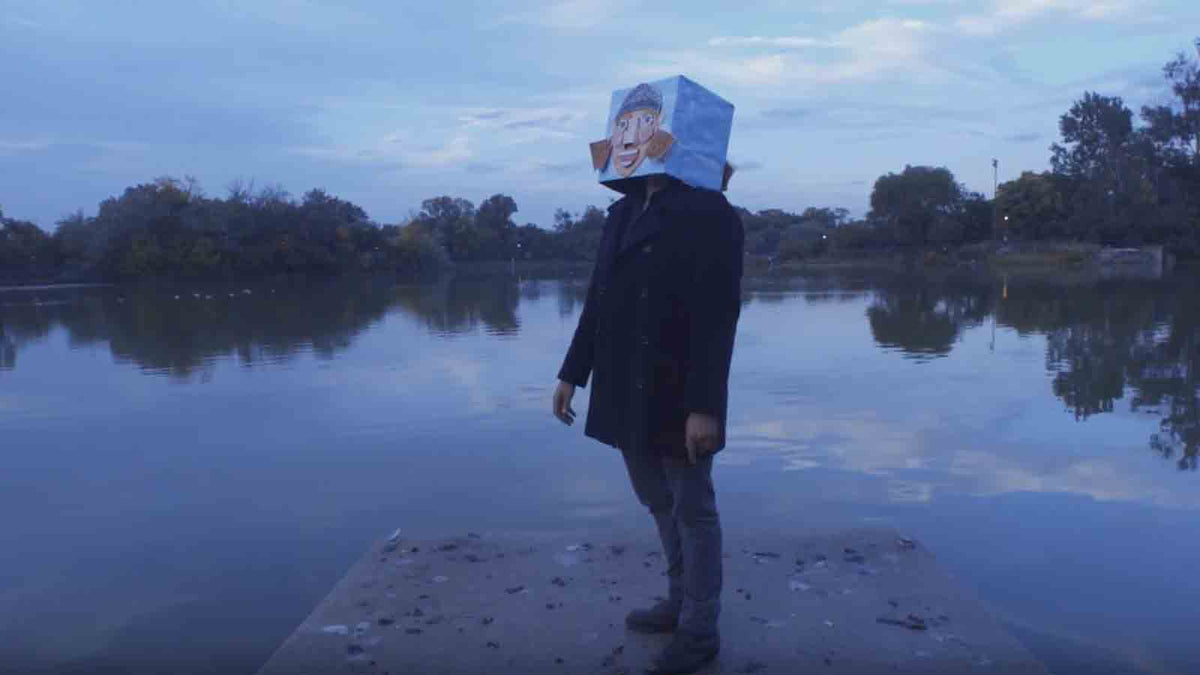 Masked Weirdo Meets Enthralling Post-Hardcore: See Slow Mass’ Surreal New Video