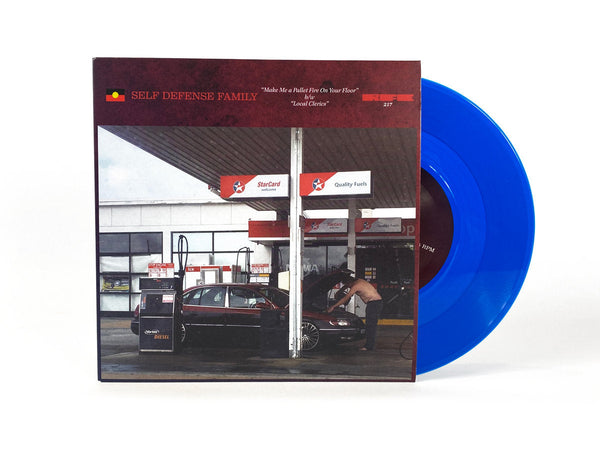 SELF DEFENSE FAMILY 'MAKE ME A PALLET FIRE ON YOUR FLOOR / LOCAL CLERICS' 7" (Blue Vinyl)